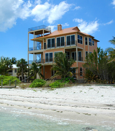 Conch Cottage on quiet island street with private pool.