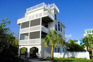 Conch Cottage on quiet island street with private pool.