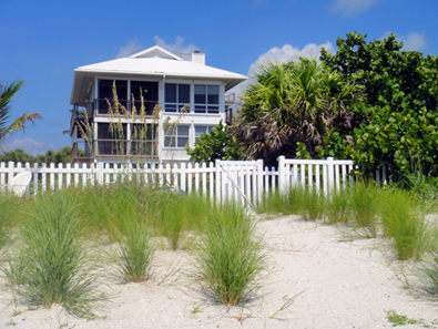 Conch Cottage on quiet island street with private pool.
